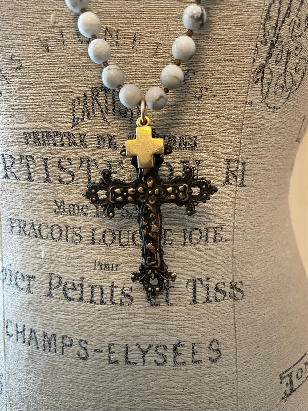 Beaded Howlite Necklace with Ornate Bronze Cross Pendant